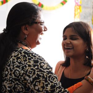 This image captures an event at Mitrajyothi,A diverse group of individuals, including renowned speakers, students, and attendees, are gathered in anticipation