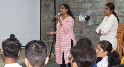Students from Atria University visited Mitra Jyothi and A woman gives a speech