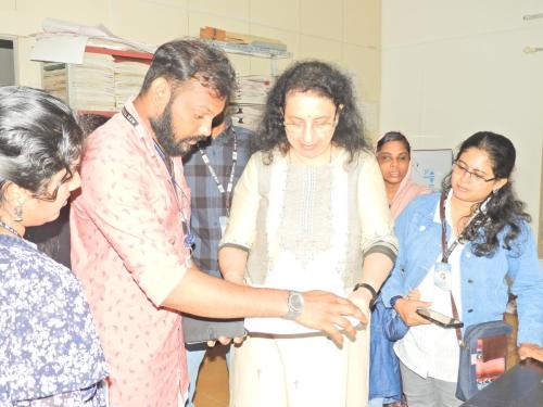 members from the Kerala Federation of the Blind, Thiruvananthapuram, listen to a presentation.